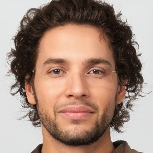 Joyful white young-adult male with medium  brown hair and brown eyes