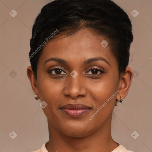 Joyful black young-adult female with short  brown hair and brown eyes
