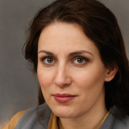 Joyful white adult female with medium  brown hair and brown eyes