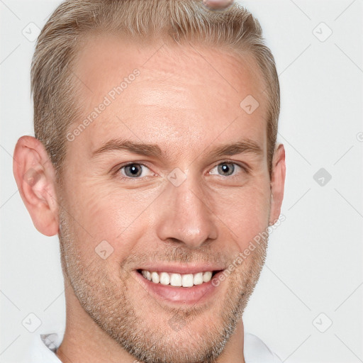 Joyful white adult male with short  brown hair and grey eyes