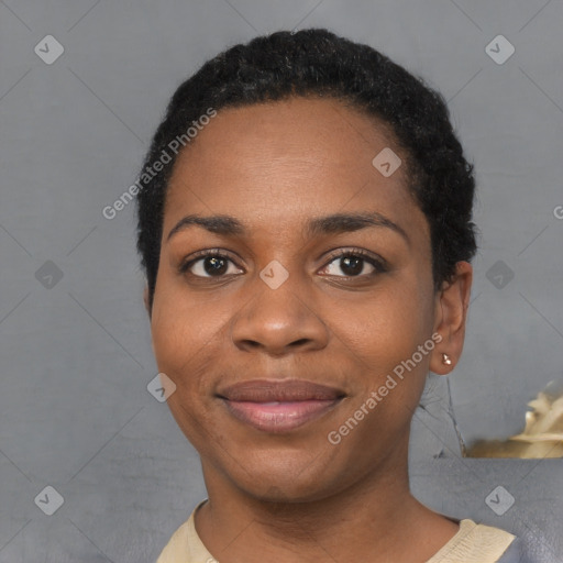 Joyful black young-adult female with short  black hair and brown eyes