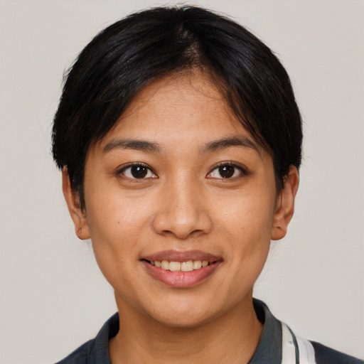 Joyful asian young-adult female with short  black hair and brown eyes