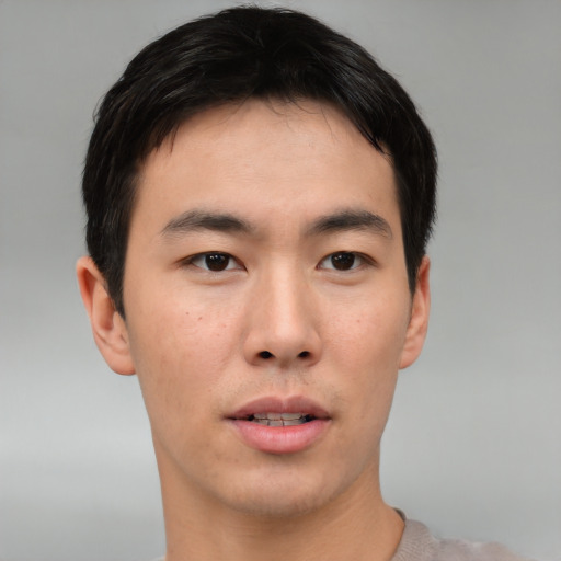 Neutral asian young-adult male with short  brown hair and brown eyes