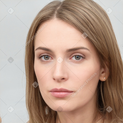 Neutral white young-adult female with long  brown hair and brown eyes