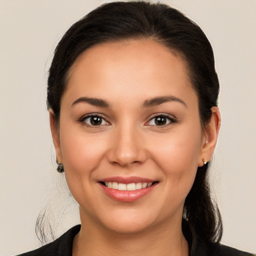 Joyful white young-adult female with long  brown hair and brown eyes