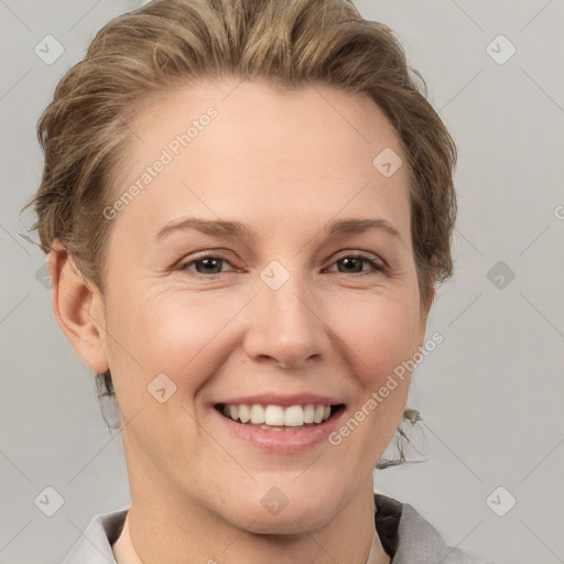 Joyful white young-adult female with short  brown hair and grey eyes