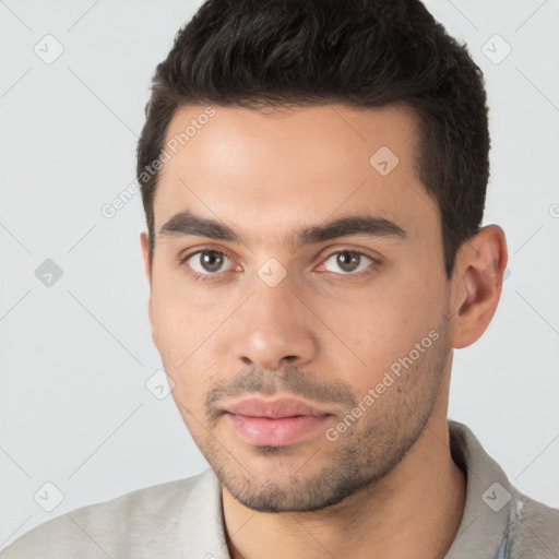 Neutral white young-adult male with short  brown hair and brown eyes