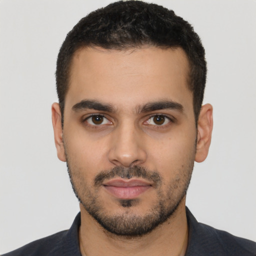 Neutral latino young-adult male with short  black hair and brown eyes