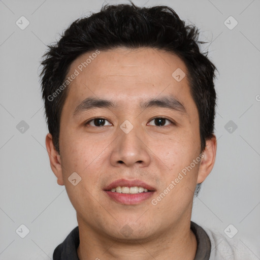 Joyful asian young-adult male with short  brown hair and brown eyes