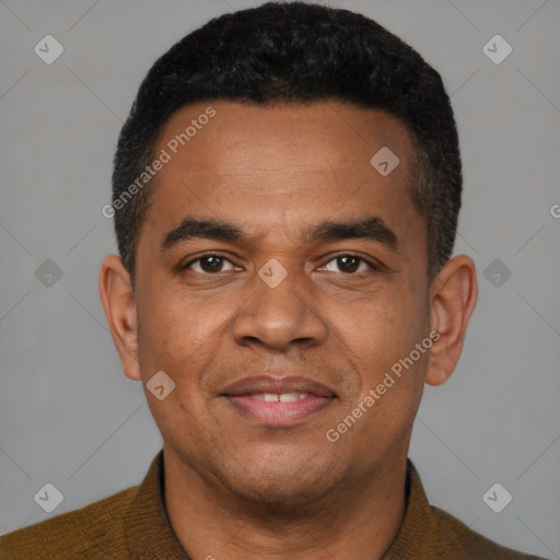 Joyful latino young-adult male with short  brown hair and brown eyes