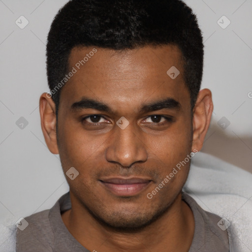 Joyful black young-adult male with short  brown hair and brown eyes