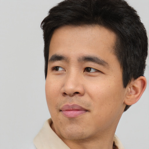 Neutral asian young-adult male with short  black hair and brown eyes