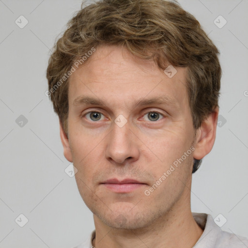 Neutral white young-adult male with short  brown hair and grey eyes