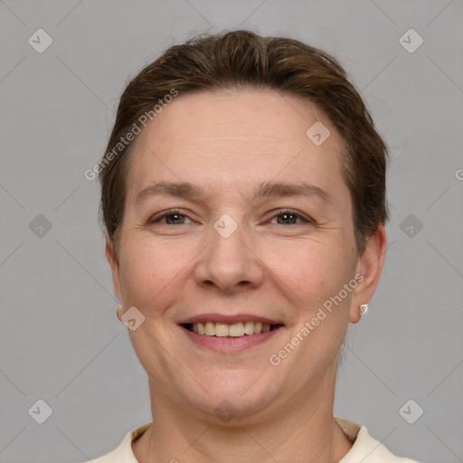 Joyful white adult female with short  brown hair and grey eyes