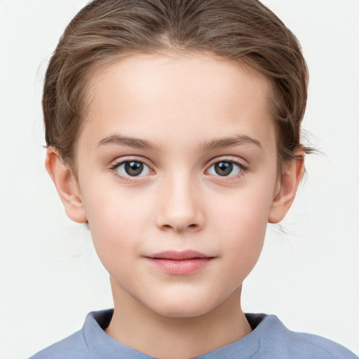 Joyful white child female with short  brown hair and grey eyes