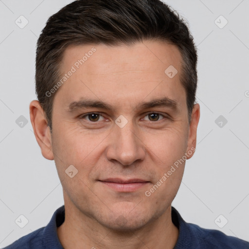 Joyful white adult male with short  brown hair and brown eyes