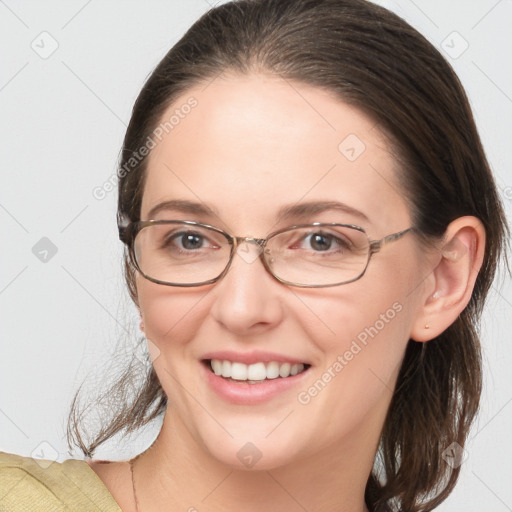 Joyful white young-adult female with medium  brown hair and grey eyes