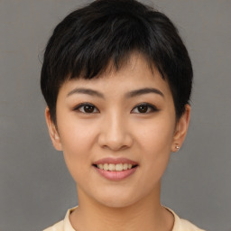 Joyful asian young-adult female with short  brown hair and brown eyes