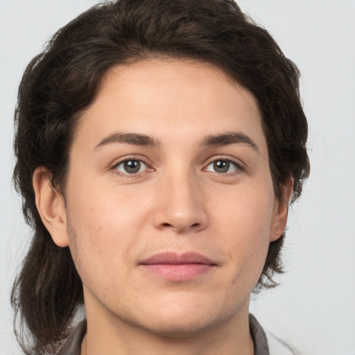 Joyful white young-adult male with medium  brown hair and brown eyes