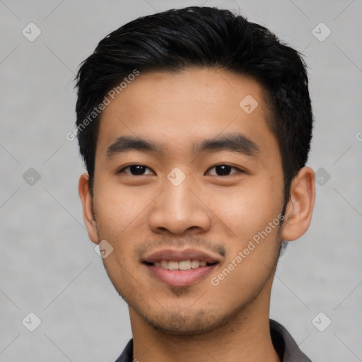 Joyful asian young-adult male with short  black hair and brown eyes