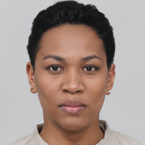 Joyful latino young-adult female with short  black hair and brown eyes