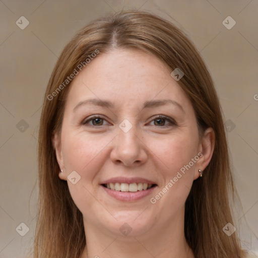 Joyful white adult female with long  brown hair and grey eyes