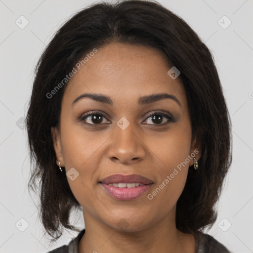 Joyful black young-adult female with medium  brown hair and brown eyes