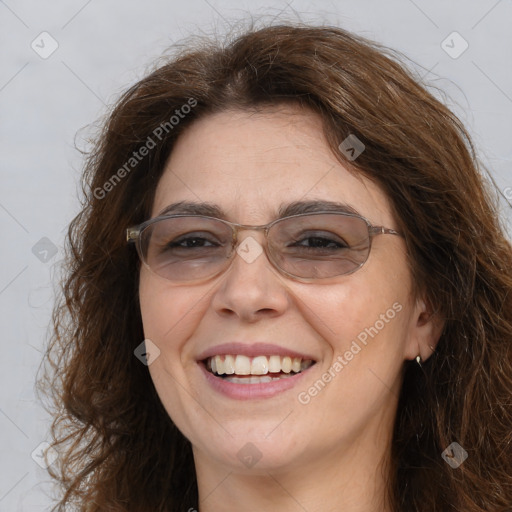 Joyful white adult female with long  brown hair and brown eyes