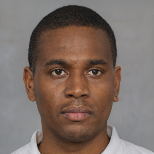 Neutral black young-adult male with short  brown hair and brown eyes