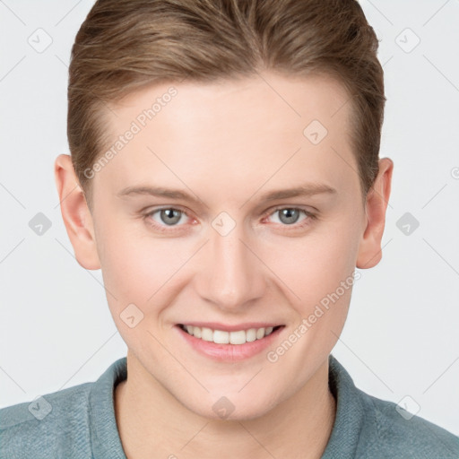 Joyful white young-adult female with short  brown hair and grey eyes