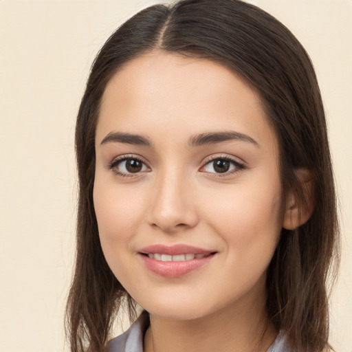 Joyful white young-adult female with long  brown hair and brown eyes