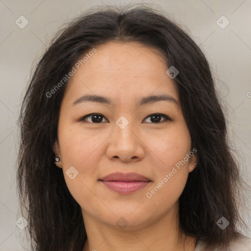 Joyful asian young-adult female with long  brown hair and brown eyes