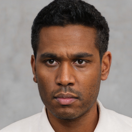 Neutral black young-adult male with short  black hair and brown eyes