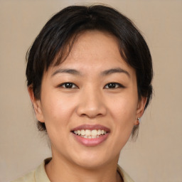 Joyful white young-adult female with medium  brown hair and brown eyes