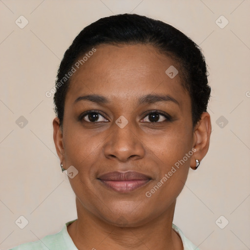 Joyful black adult female with short  black hair and brown eyes
