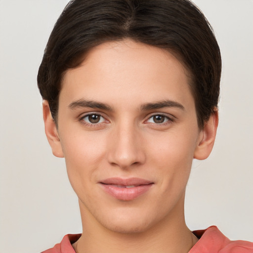 Joyful white young-adult female with short  brown hair and brown eyes