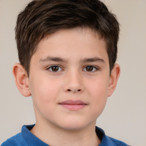 Joyful white child male with short  brown hair and brown eyes