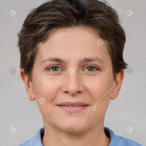 Joyful white adult female with short  brown hair and brown eyes