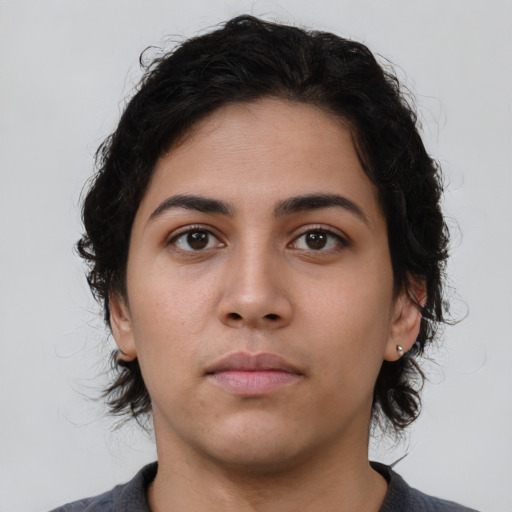 Neutral latino young-adult female with medium  brown hair and brown eyes