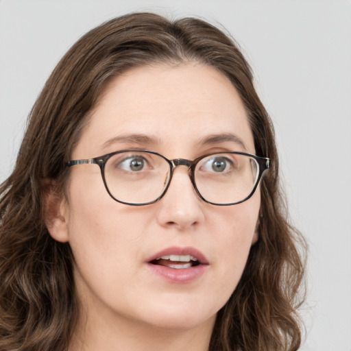 Neutral white young-adult female with long  brown hair and blue eyes