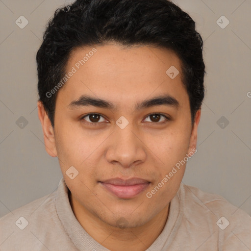 Joyful latino young-adult male with short  brown hair and brown eyes