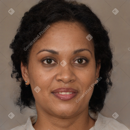 Joyful black adult female with medium  brown hair and brown eyes