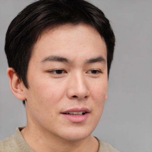 Joyful asian young-adult male with short  brown hair and brown eyes