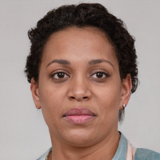 Neutral black adult female with short  brown hair and brown eyes
