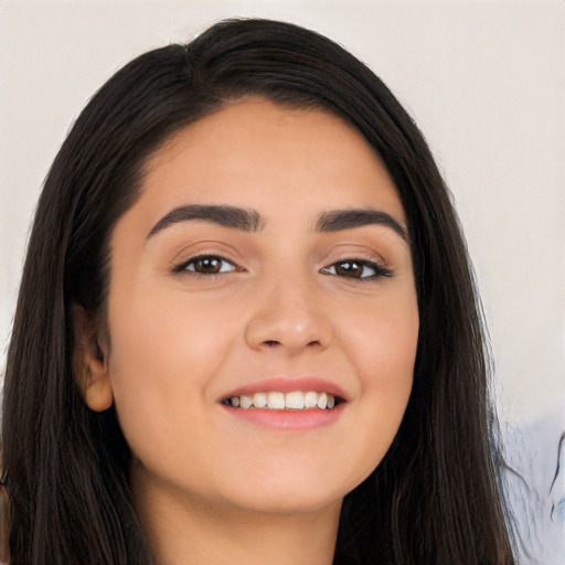 Joyful white young-adult female with long  black hair and brown eyes