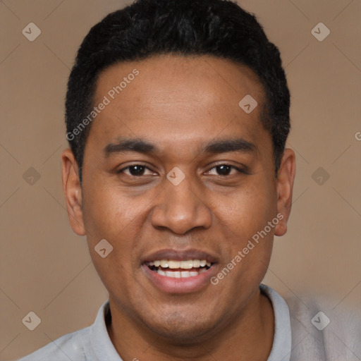 Joyful black young-adult male with short  black hair and brown eyes