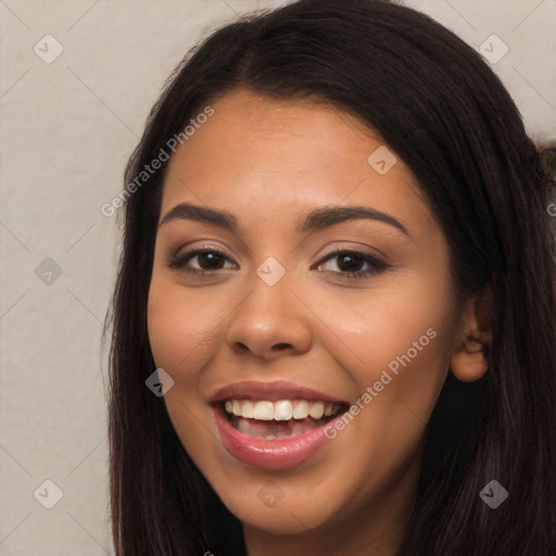 Joyful latino young-adult female with long  black hair and brown eyes