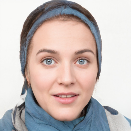 Joyful white young-adult female with medium  brown hair and blue eyes