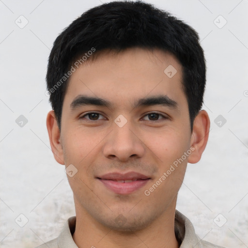 Joyful asian young-adult male with short  brown hair and brown eyes