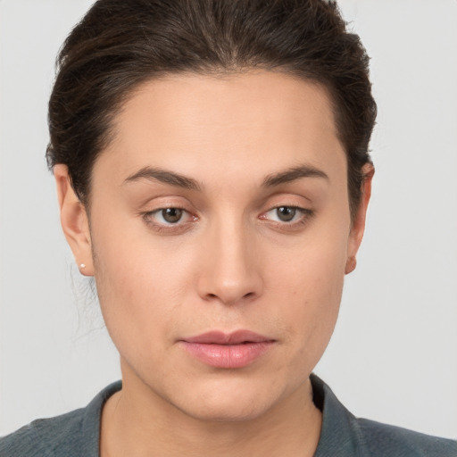 Neutral white young-adult female with short  brown hair and brown eyes